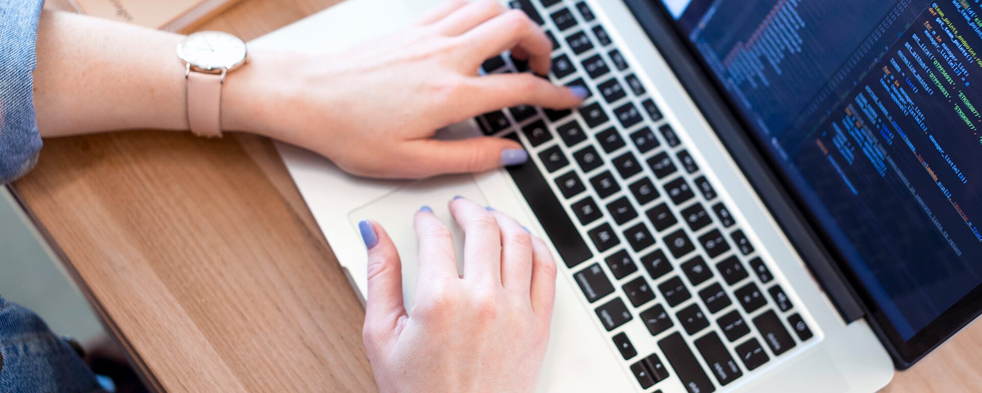Close up of Capital One associate typing on laptop