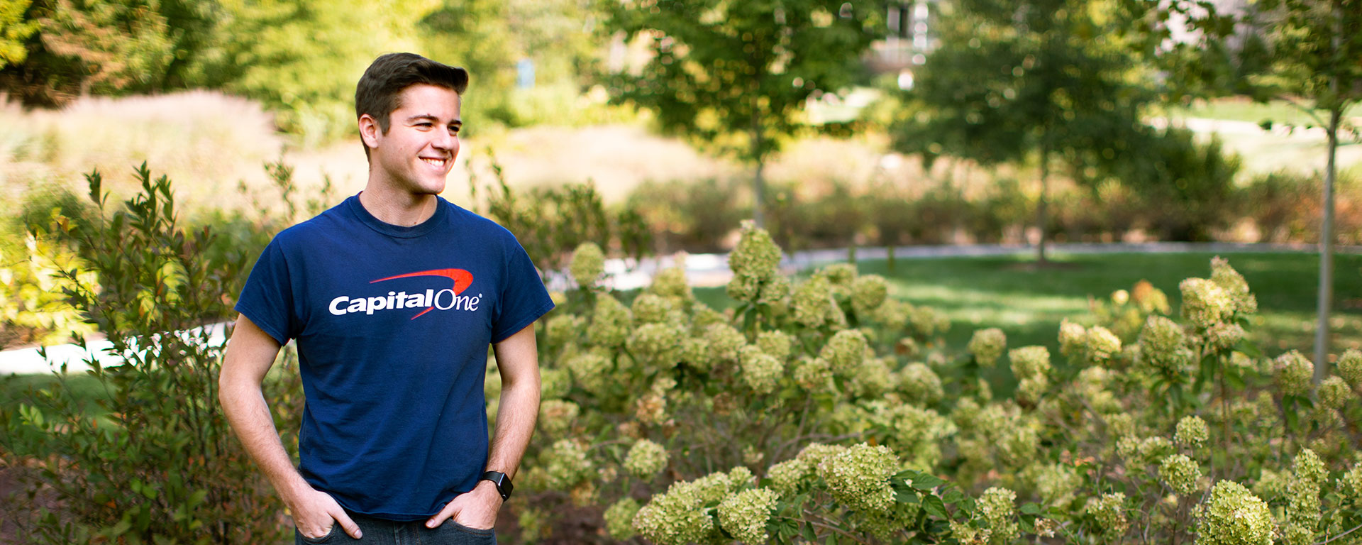 tech recruiter standing outside in capital one shirt