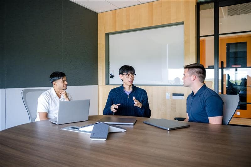 Associates at a conference table