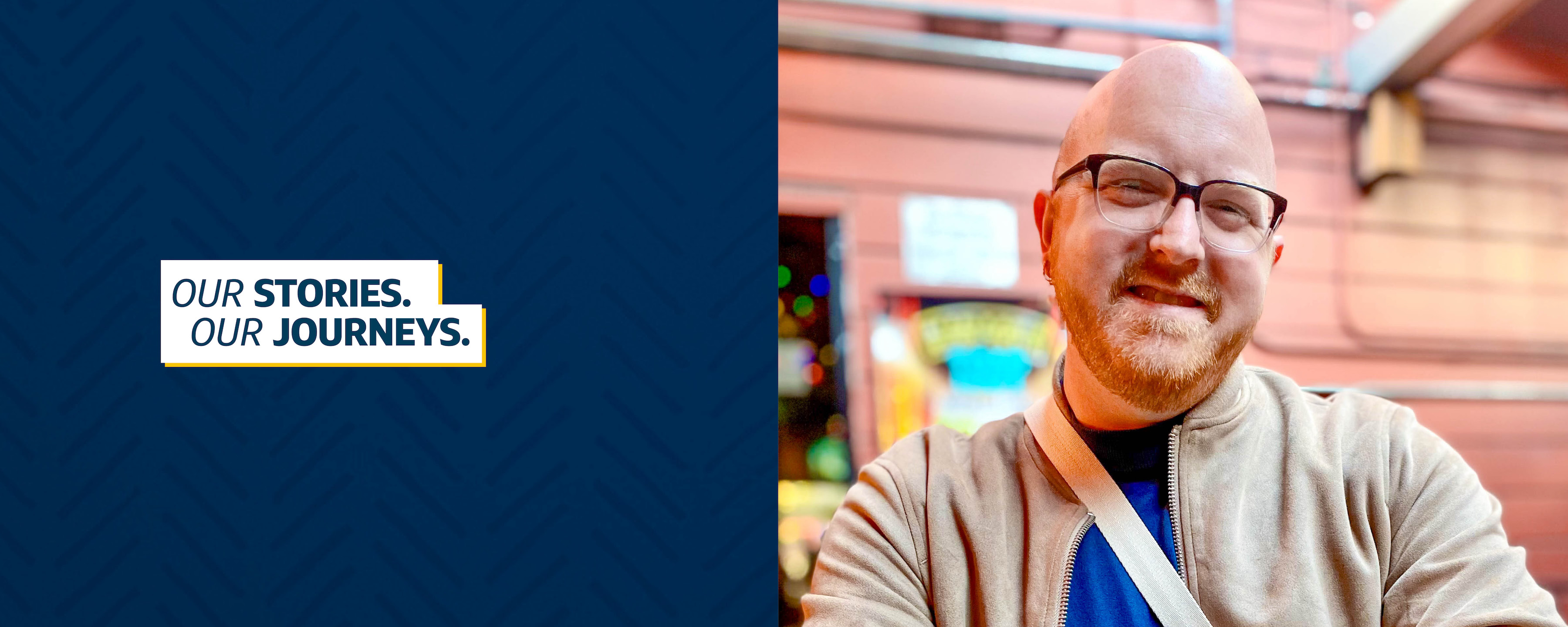 Capital One associate Zack stands outside in front of a building and smiles, with a title overlay "Our Stories, Our Journeys"