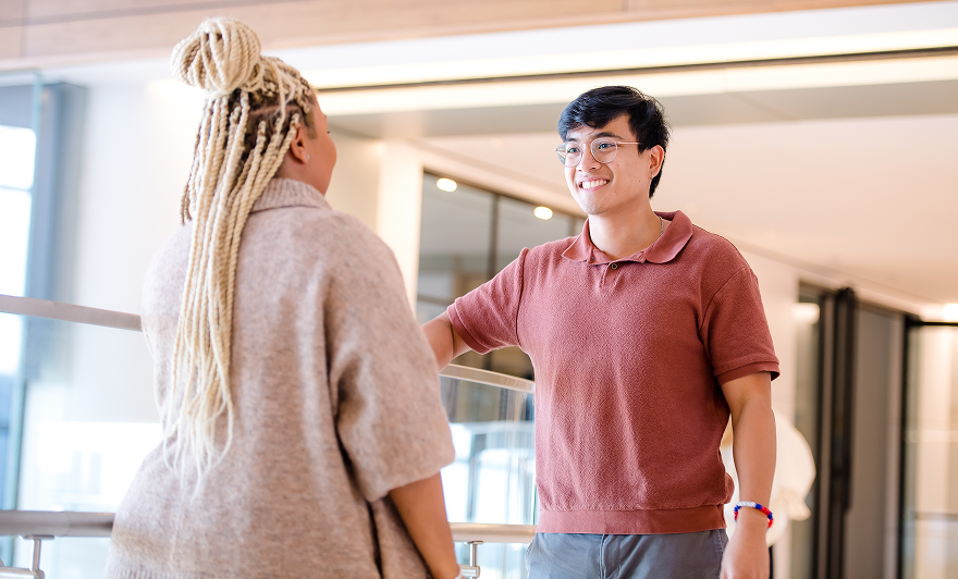 two associates talking in office